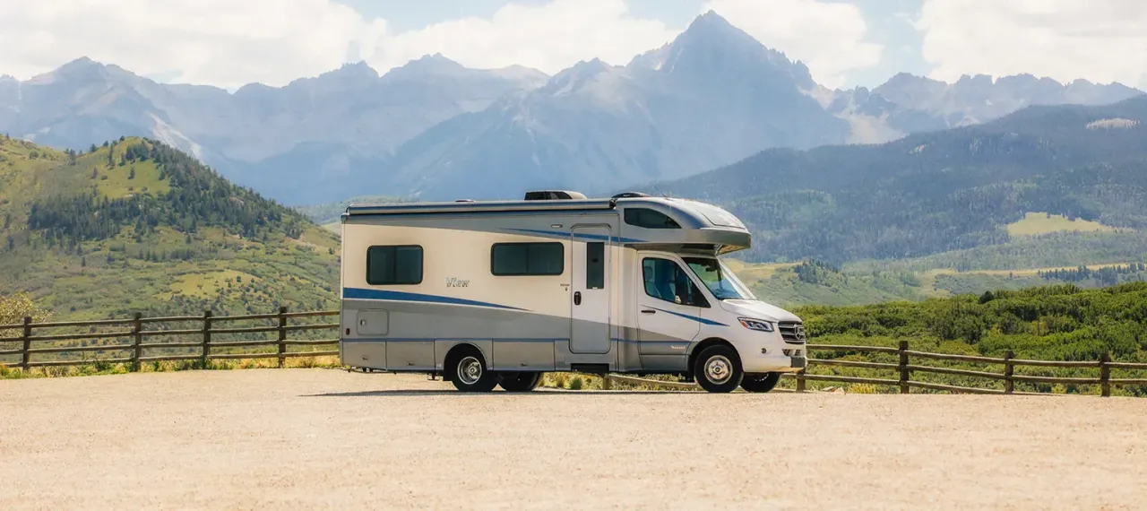 Motorhome parked with mountains in the background
